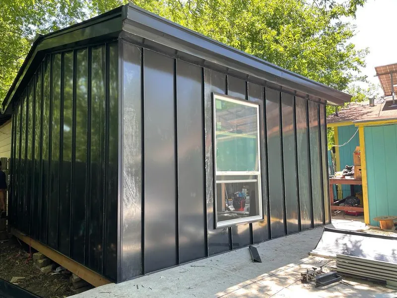 Black standing seam metal wall panels for Roof Inspection in Aurora